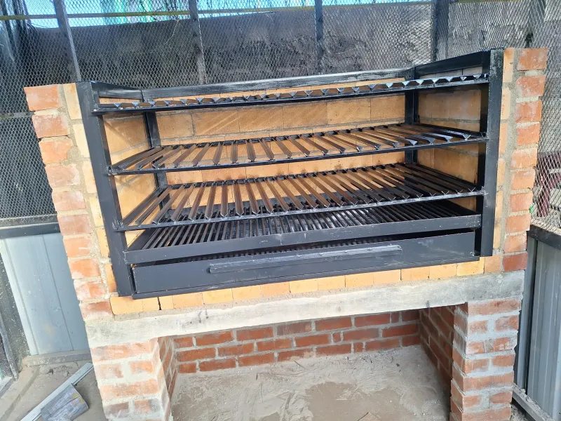 Large brick BBQ grill with triple steel racks by Kenbrick Ovens
